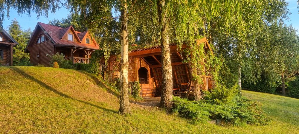 Domek nad jeziorem z linią brzegową na Mazurach Ryn Rybical - Staś