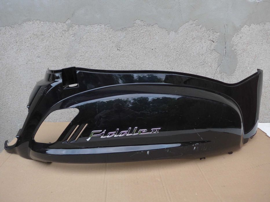 Sym Fiddle II '08-14r OWIEWKA prawy tył emblemat