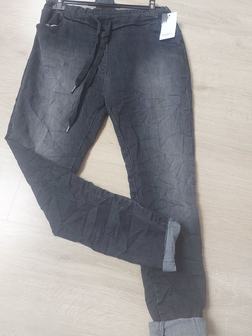 Spodnie gnieciuchy imitacja przetartego jeansu