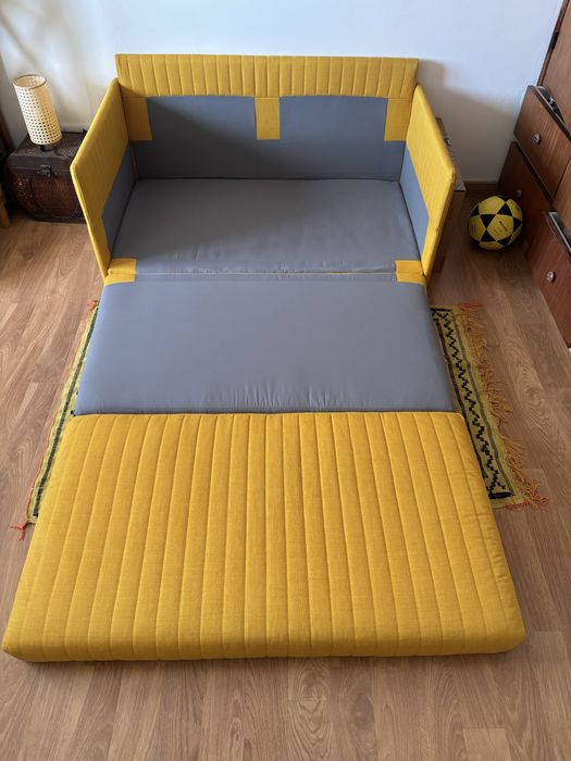 Sofá-cama Skiftebo amarelo