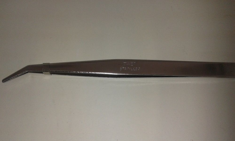 Pinça curva para máquina de costura