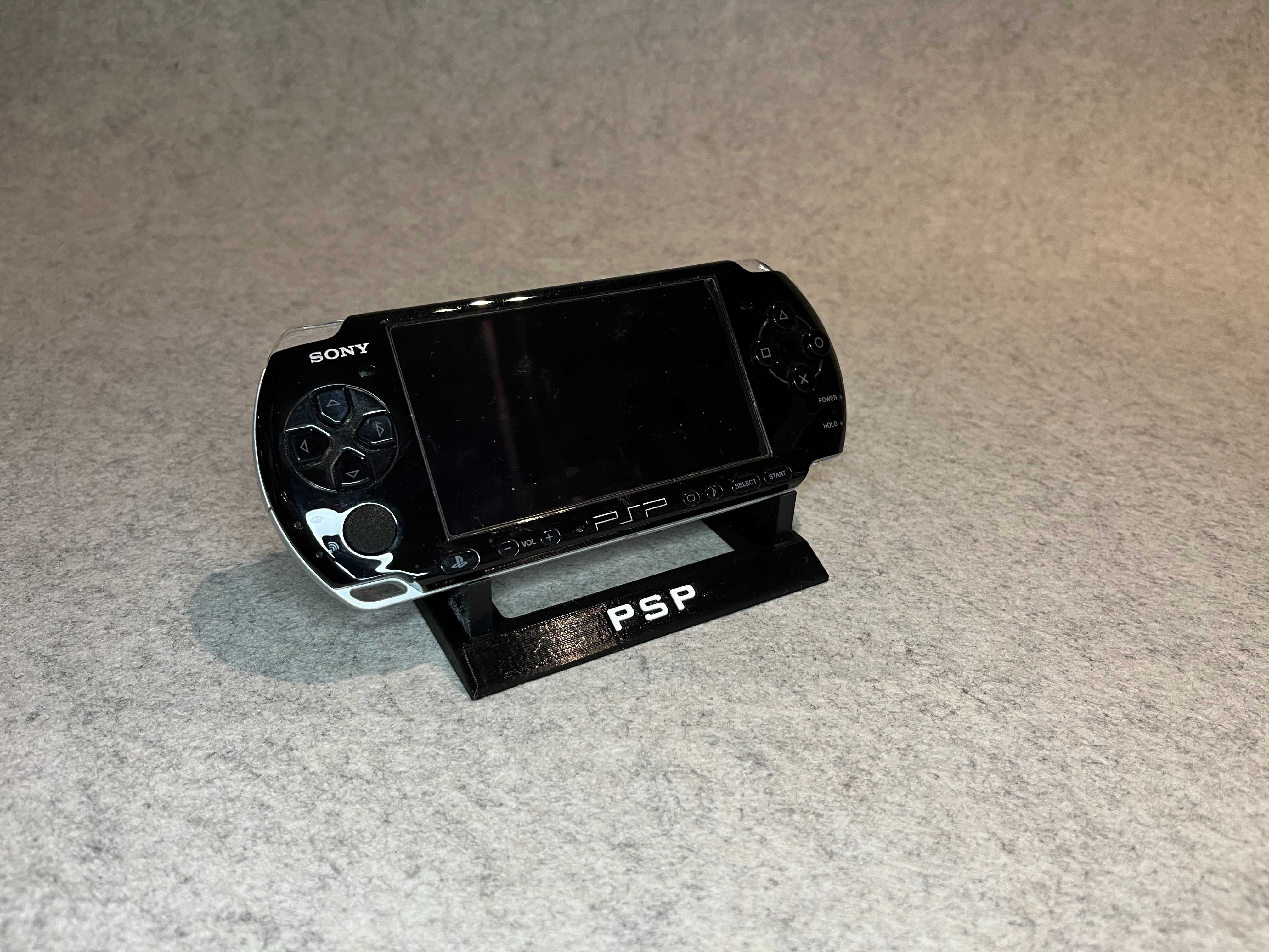 Zestaw stojakow na 12 gier oraz konsole PSP PlayStation Portable
