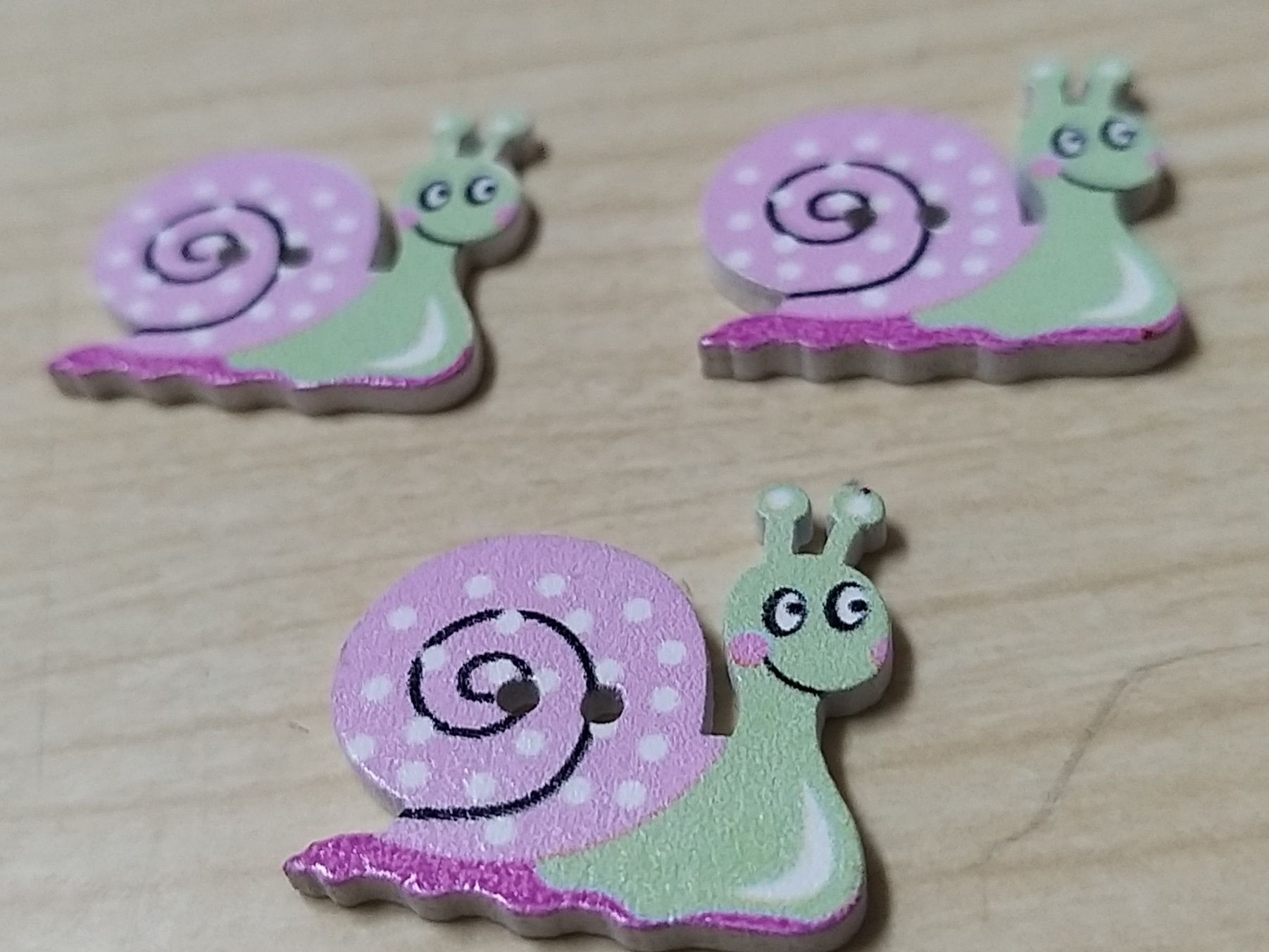 Botões Caracóis.