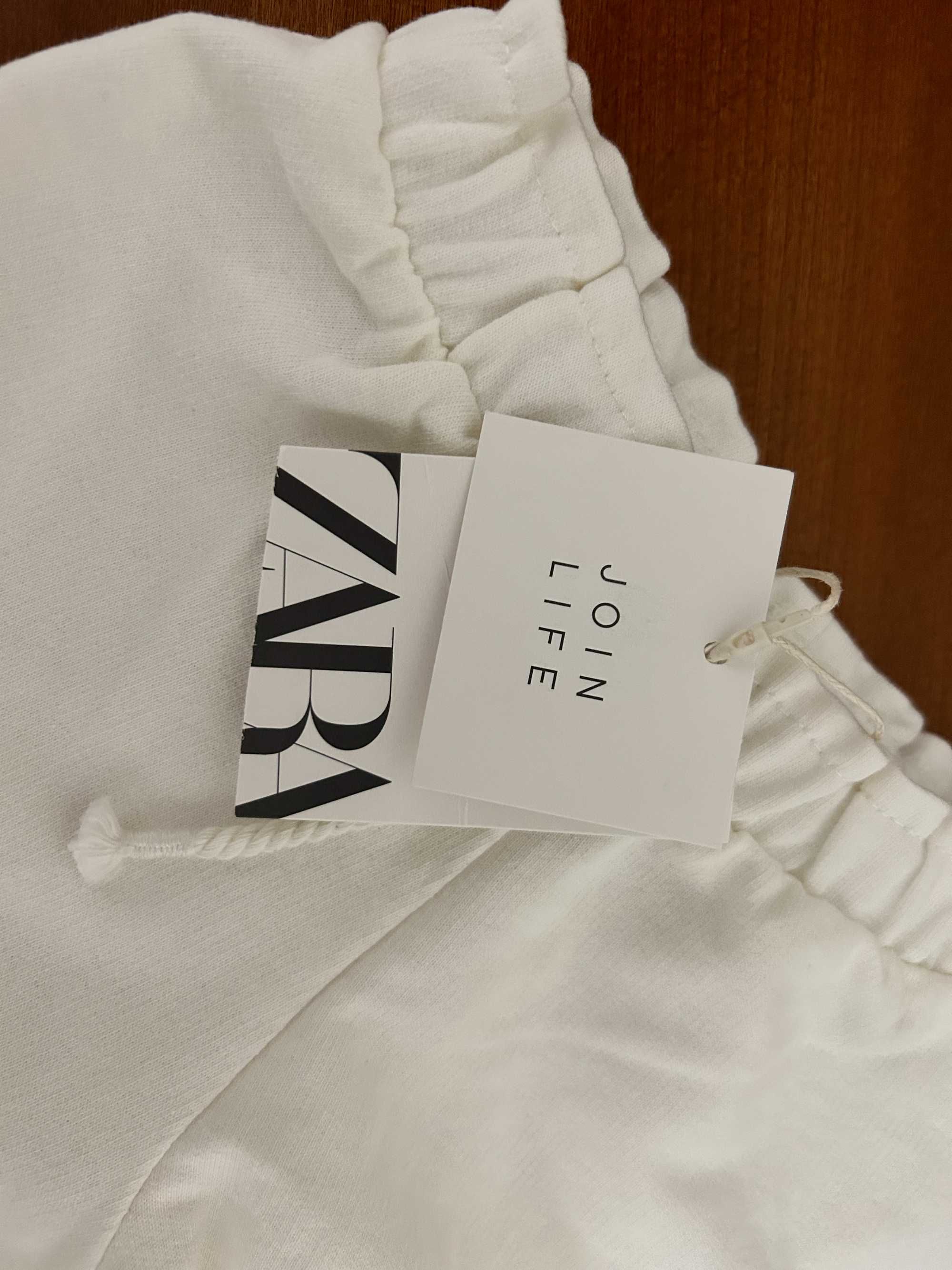 Calções brancos Zara com etiqueta