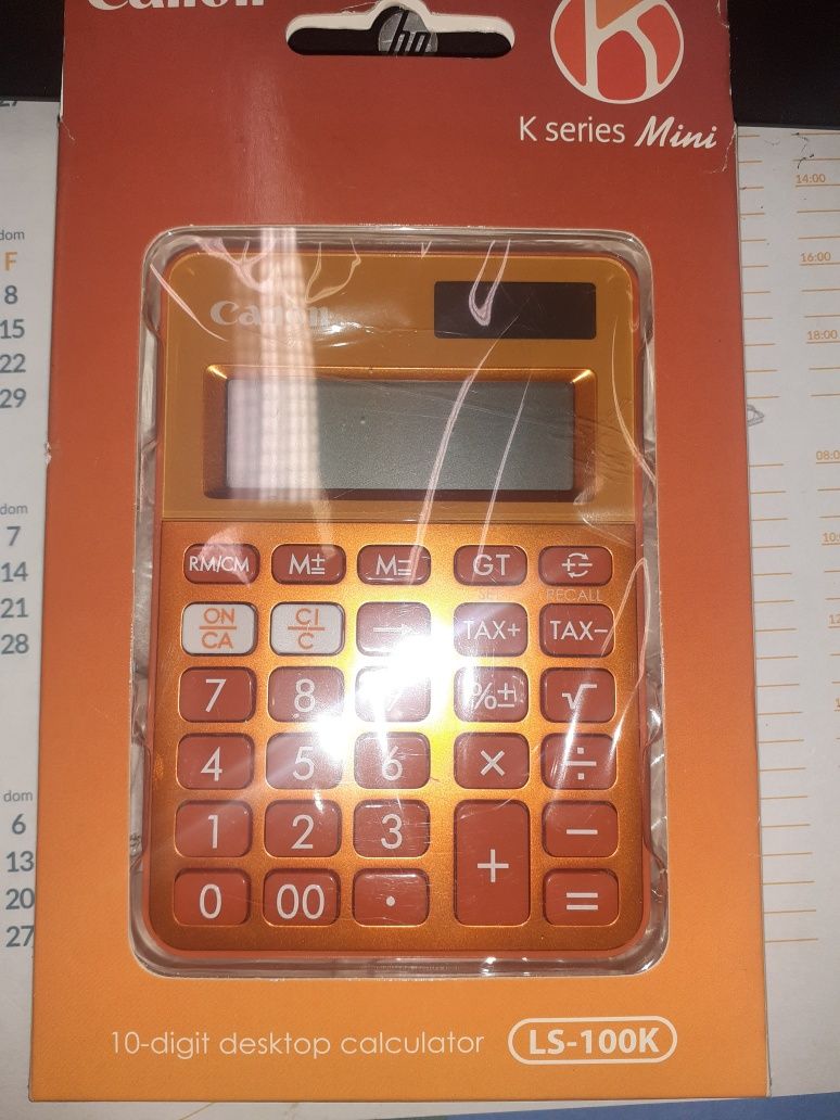 Máquina calculadora laranja da Canon.