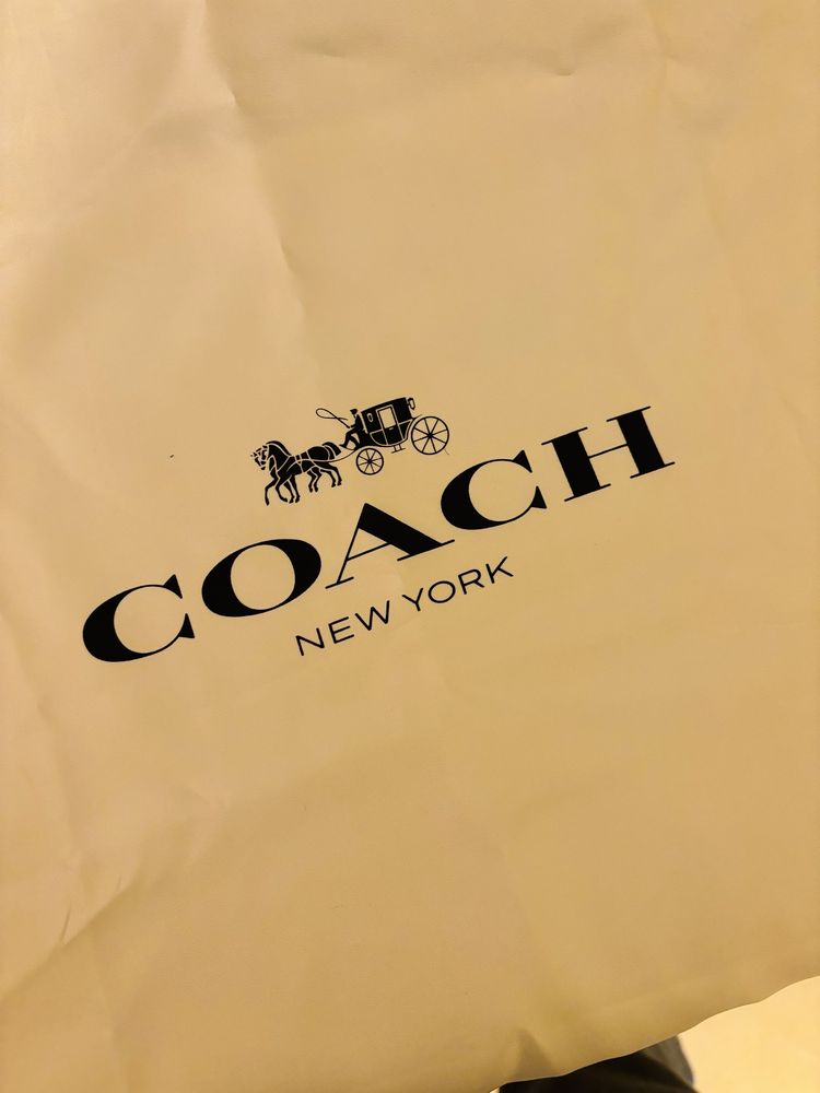 Mala em pele da Coach. Com saco. Nova.