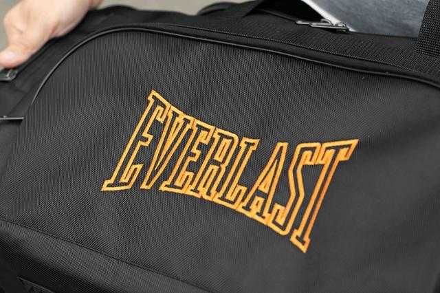 Чоловіча дорожна сумка EVERLAST Orange спортивна чорна на 60л