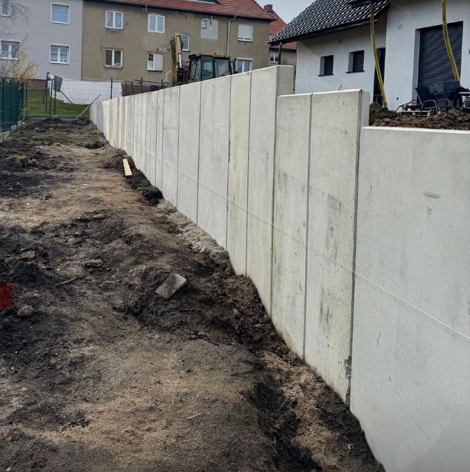 Układanie murów oporowych typu L