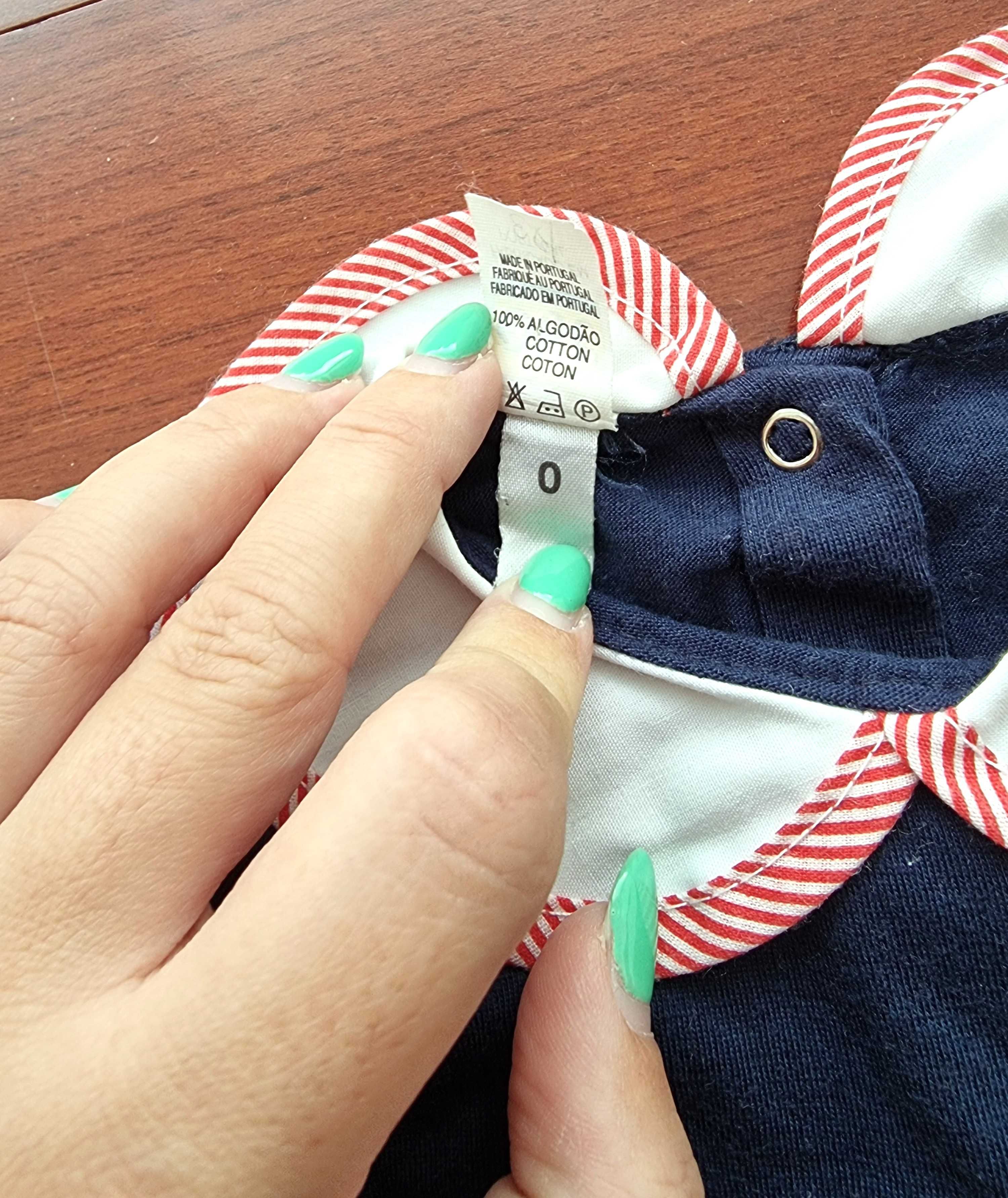 Romper azul com detalhe na gola e um urso 100% algodão, recém-nascido