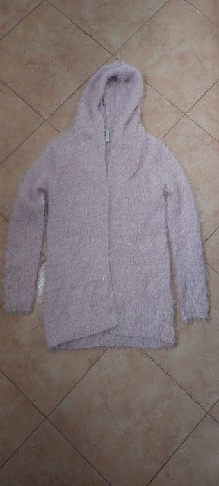 Vende-se um casaco de pêlo rosa