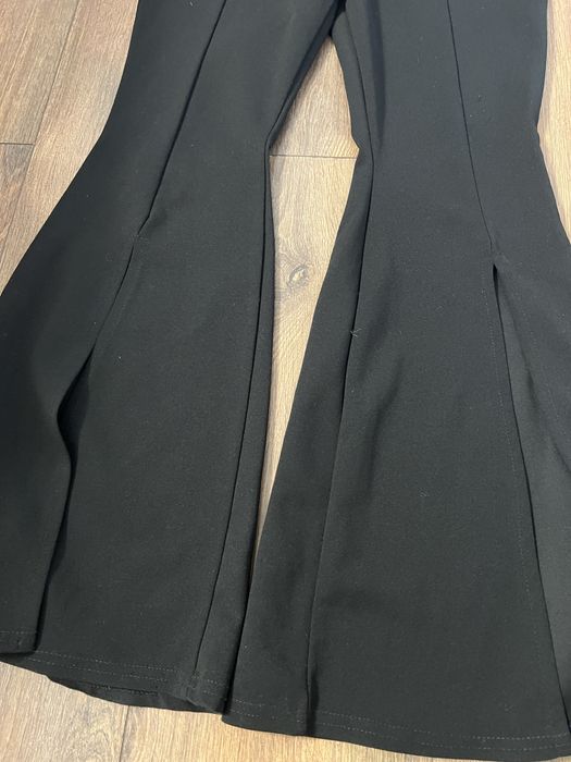 Штани кльош чорного кольору