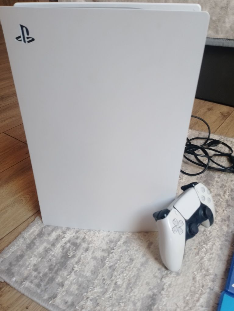 Sprzedam ps 5 z napędem, padem i 4 gry.