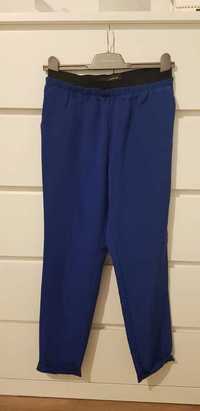 Spodnie materiałowe luźne niebieskie Reserved