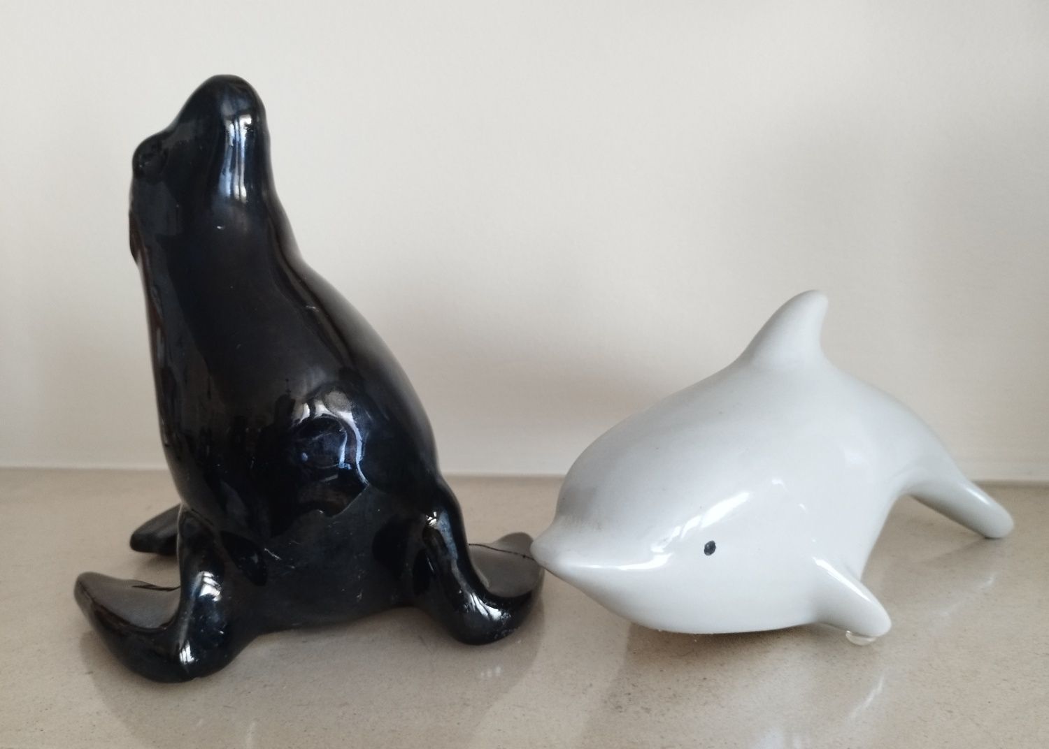 Foca e golfinho em porcelana