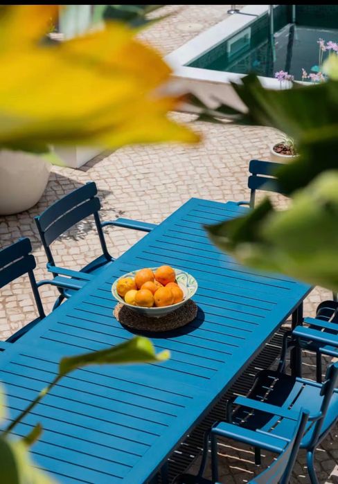 FERMOB extendable garden table including 8 chairs with armrests