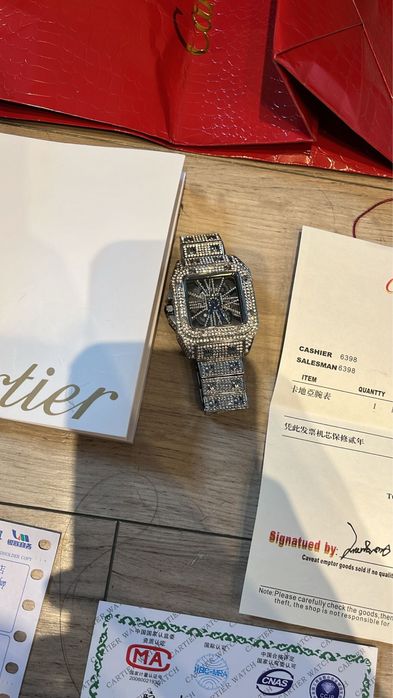Cartier santos skeleton iced out