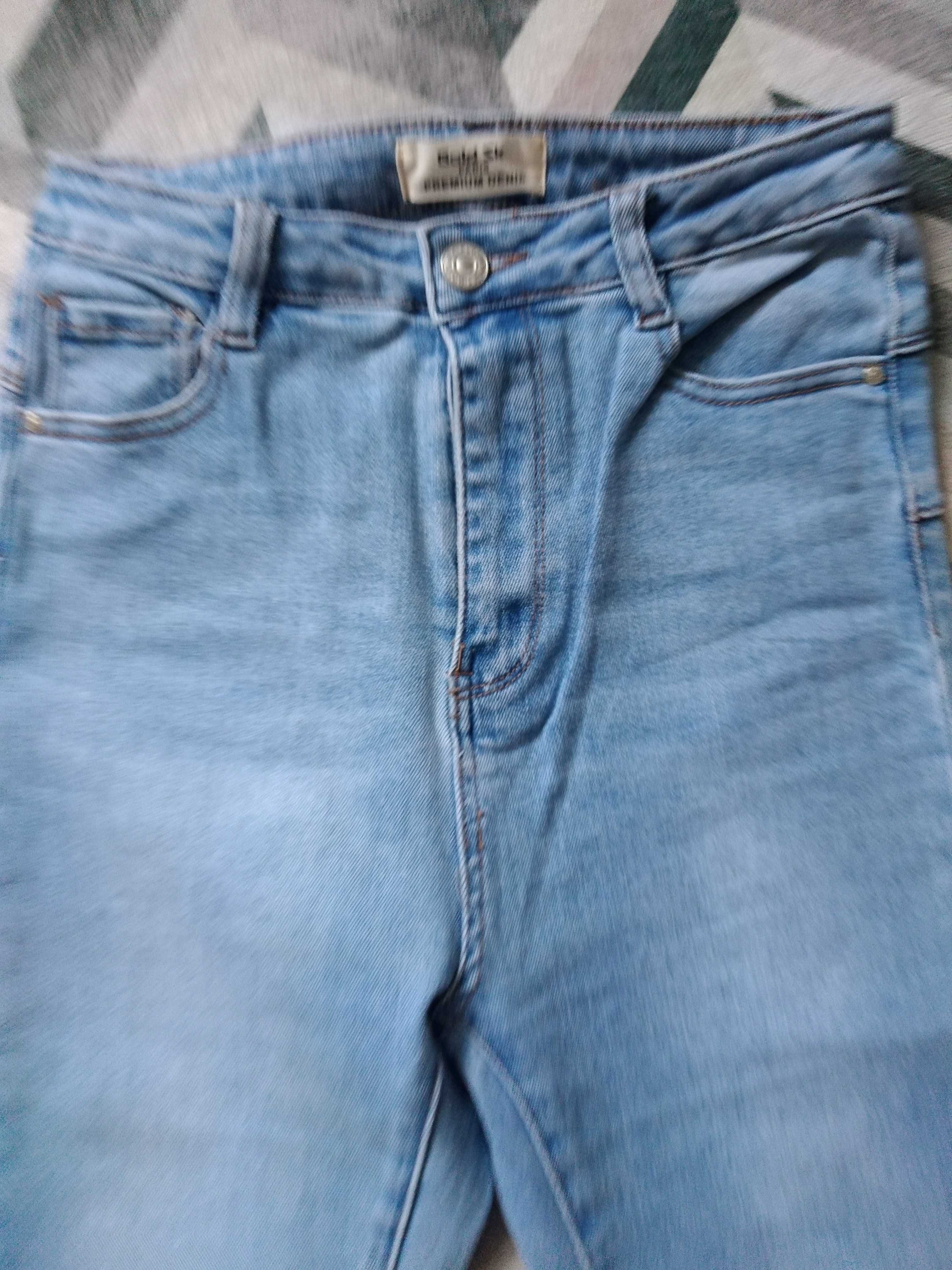 Spodnie jeansy przetarte