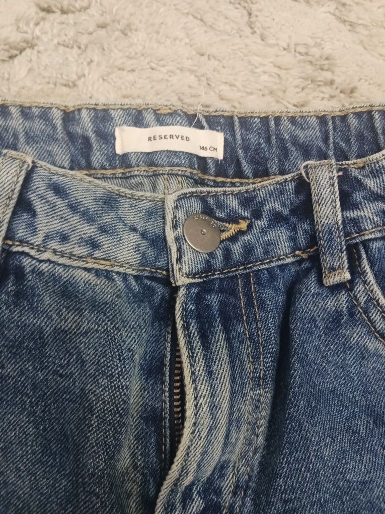 Spodnie jeans dziewczęce z dziurami roz 146 Reserved