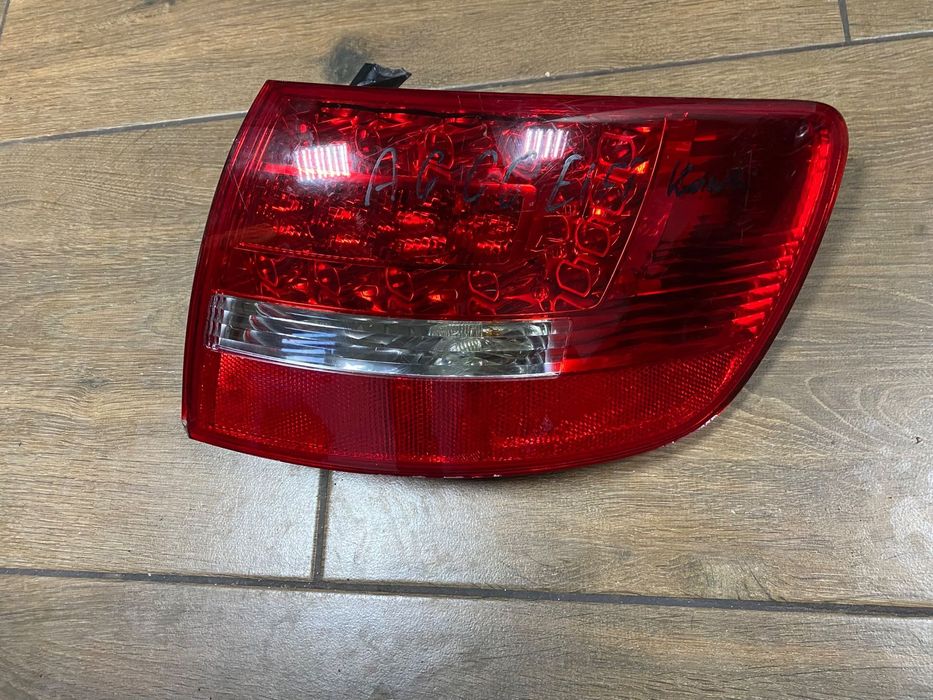 LAMPA PRAWY TYŁ W BŁOTNIK AUDI A6 C6 LIFT 4F9945096E ORG.