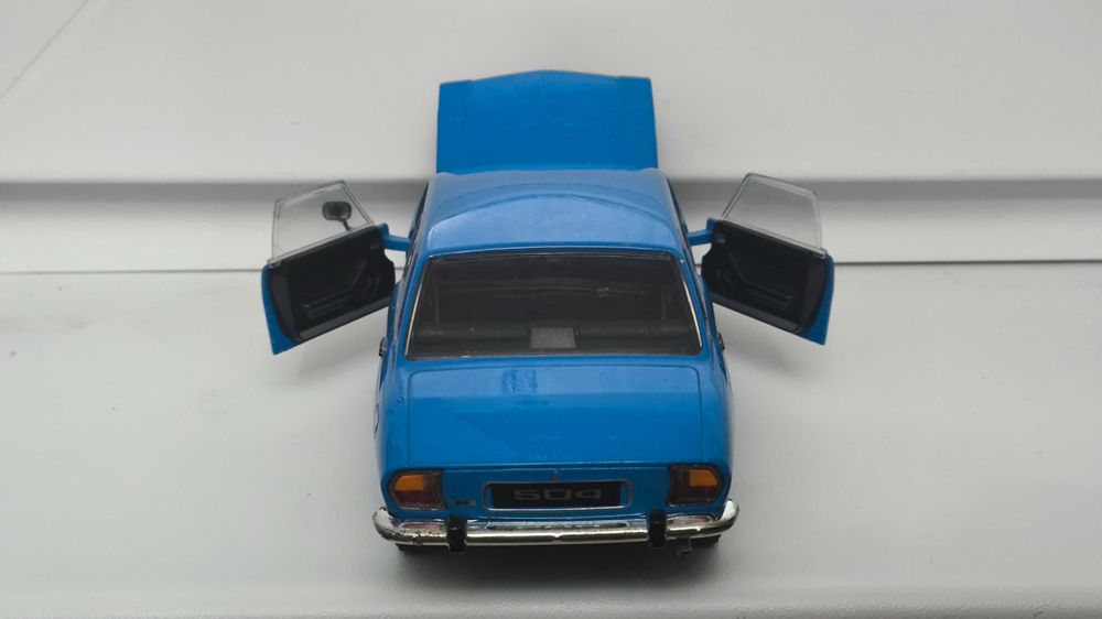 Модель, машинка Peugeot 504 1975 1.24 Welly
