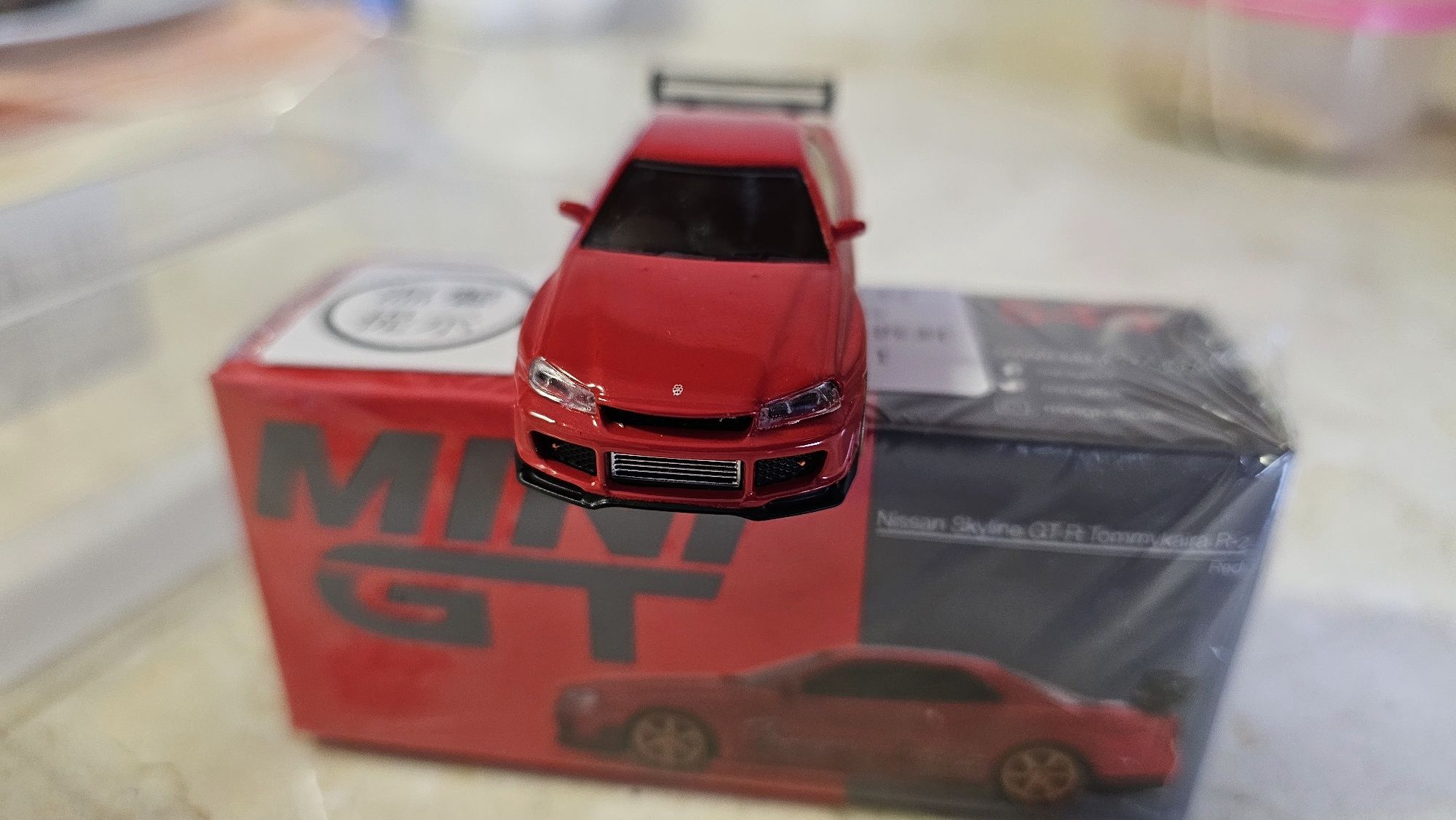 Mini GT 543 Nissan Skyline GT-R (R34) Tommykaira R RZ Edition Red