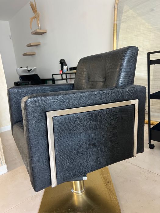 Cadeira de cabeleireiro.