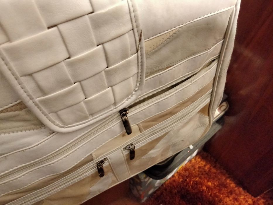 Mala em pele verdadeira.