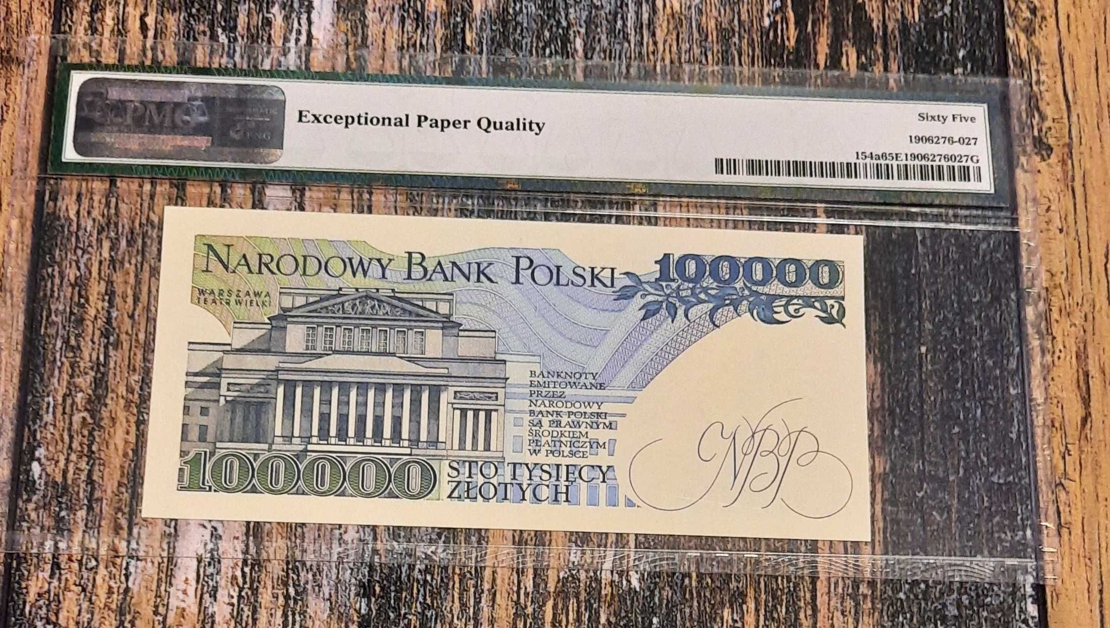 Banknot 100000 zł.prl w gradingu widoczny na skanie 1990r