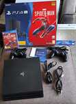 Konsola PS4 Pro 1 TB + 2 pady + 7 gier GRATIS - stan idealny