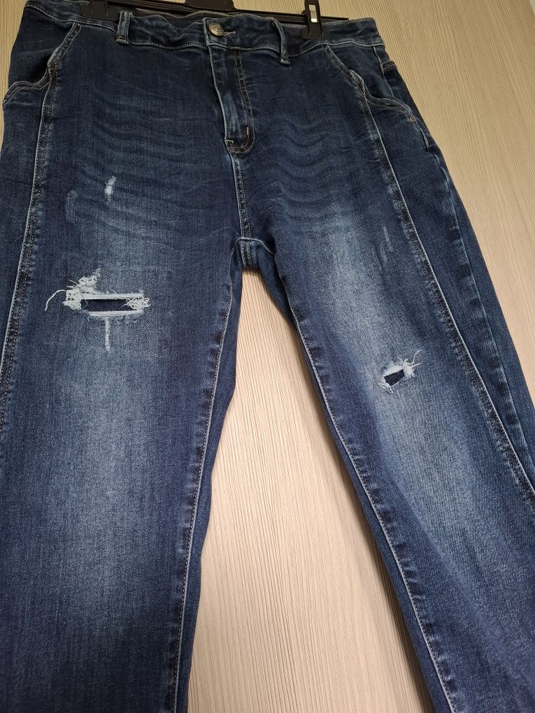Jeansowe granatowe spodnie z podszytymi dziurami r.xl + gratis
