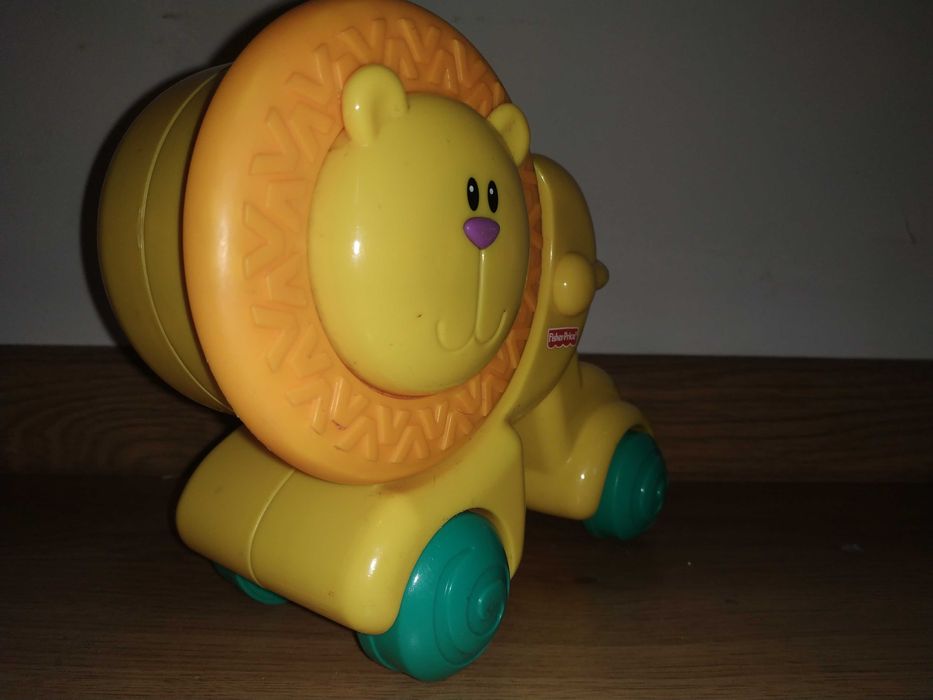 Lew fisher price naciśnij i jedź