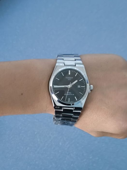 Годинник Tissot PRX, Patek Phillippe Nautilus.