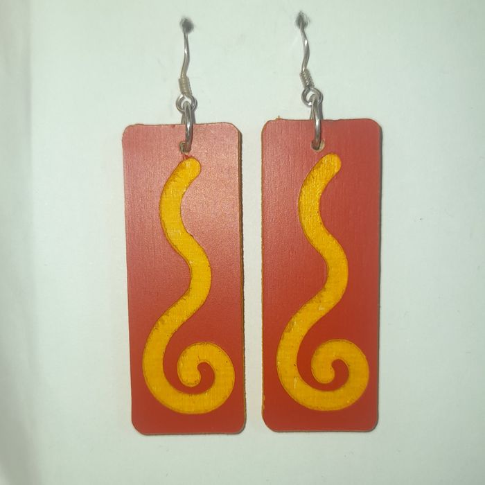 Wooden earrings in the shape of spirals.
