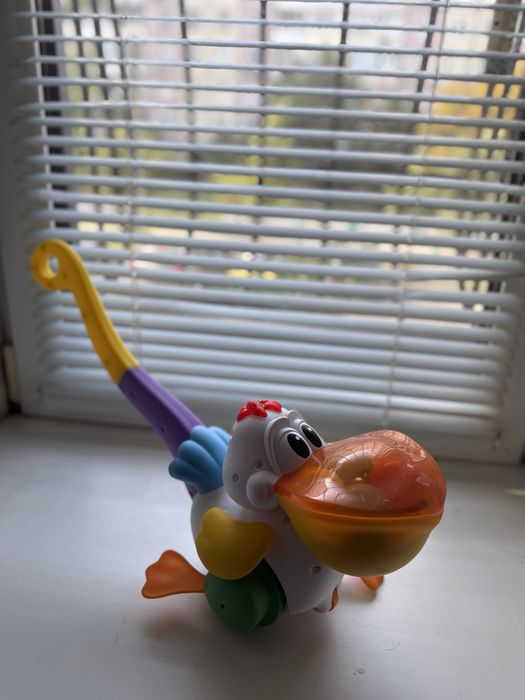 Іграшка каталка пелікан-витівник Kiddieland