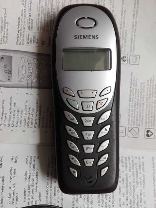 Telefon stacjonarny Siemens z ładowarką i instrukcją