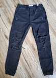 Bershka S 36 38 czarne spodnie szarpane dziury modne rurki wysoki stan