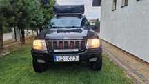 Wynajem samochodów terenowych jeep grand cherokee WJ z namiotem dachow