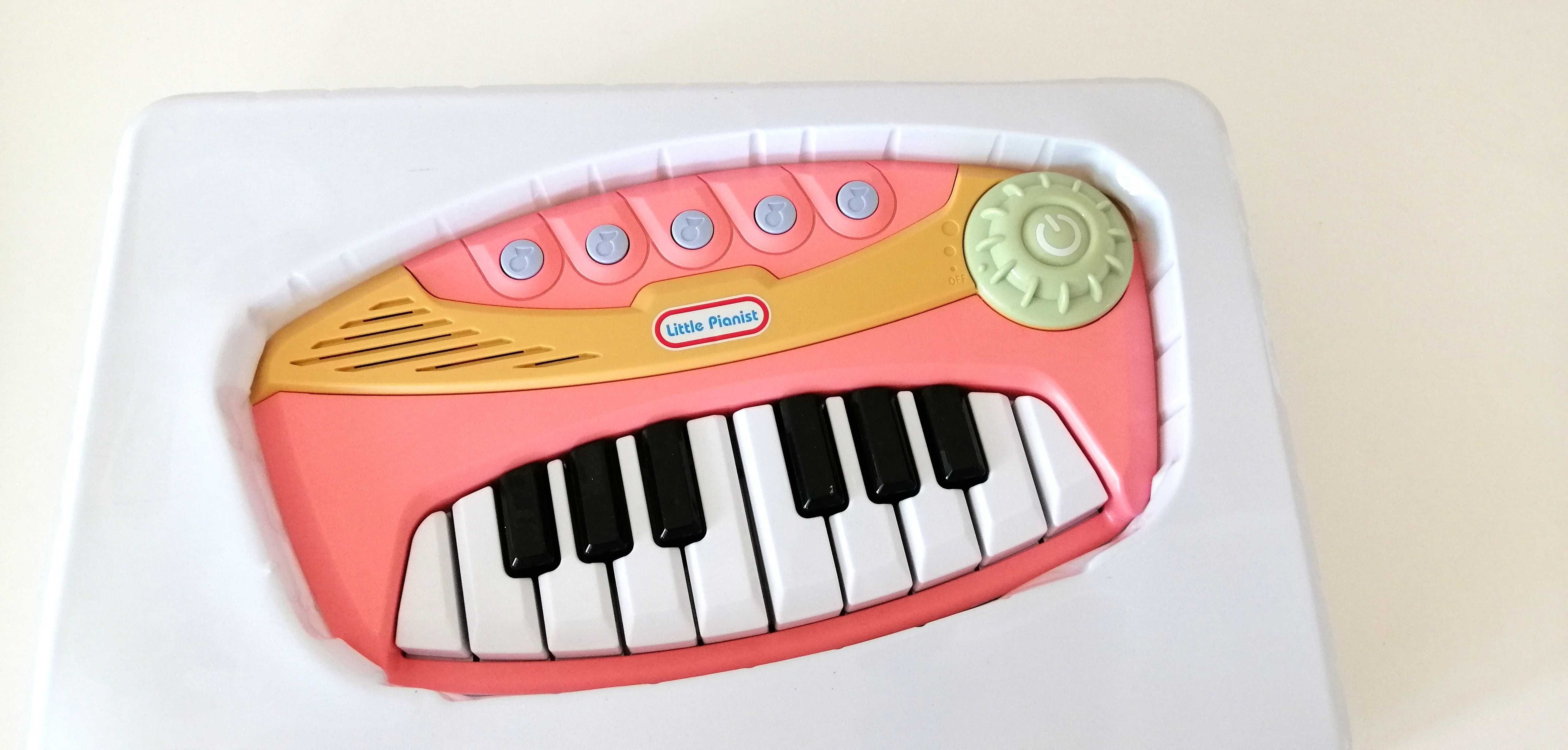 jasnoróżowe grające elektroniczne pianino pianinko smiki smyk keyboard