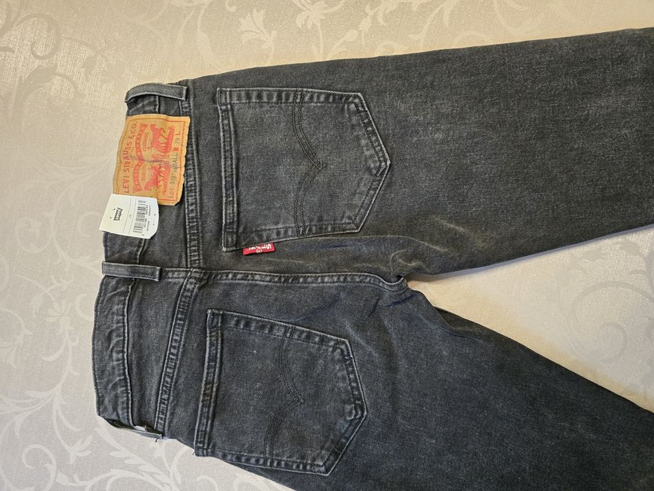 Nowe spodnie Levisy 519 unisex W29 czarne