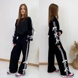 Якісний костюм для дівчинки з бантиками 134,140,164
