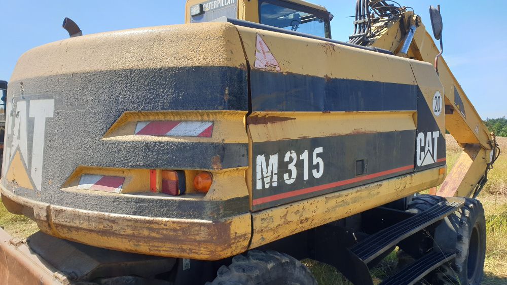 koparka cat m 315 m 318 części pług lemiesz siłownik silnik ramie wał