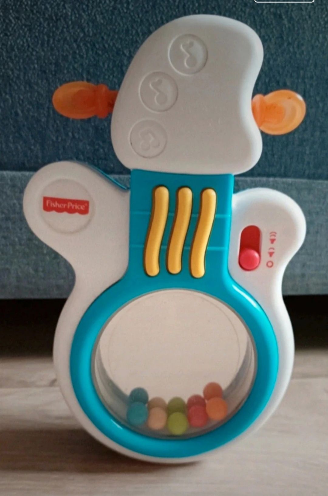 Fisher Price gitara grająca melodie grzechotka wańka wstańka z lusterk