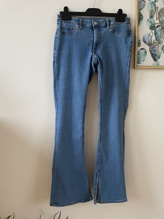Niebieskie jeansy flare H&M 158 rozcięcia