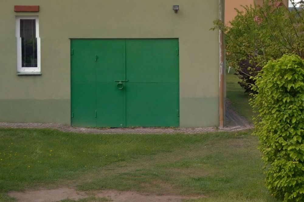 металеві утеплені гаражні ворота