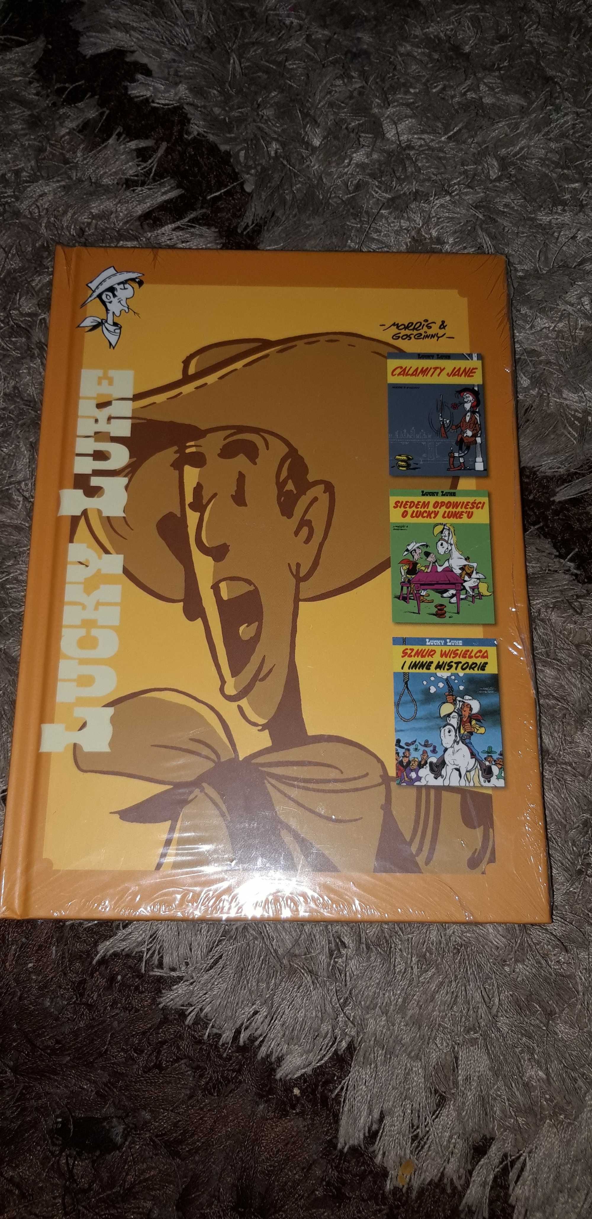 Komiks Lucky Luke okładka żółta twarda trzy czesci w jednym komiksie