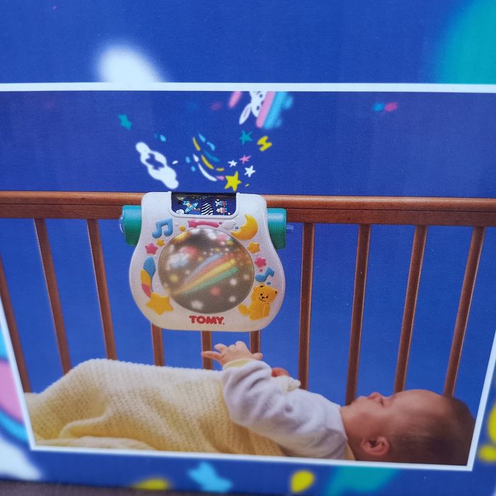 Brinquedo musical com projetor de imagem para bebé