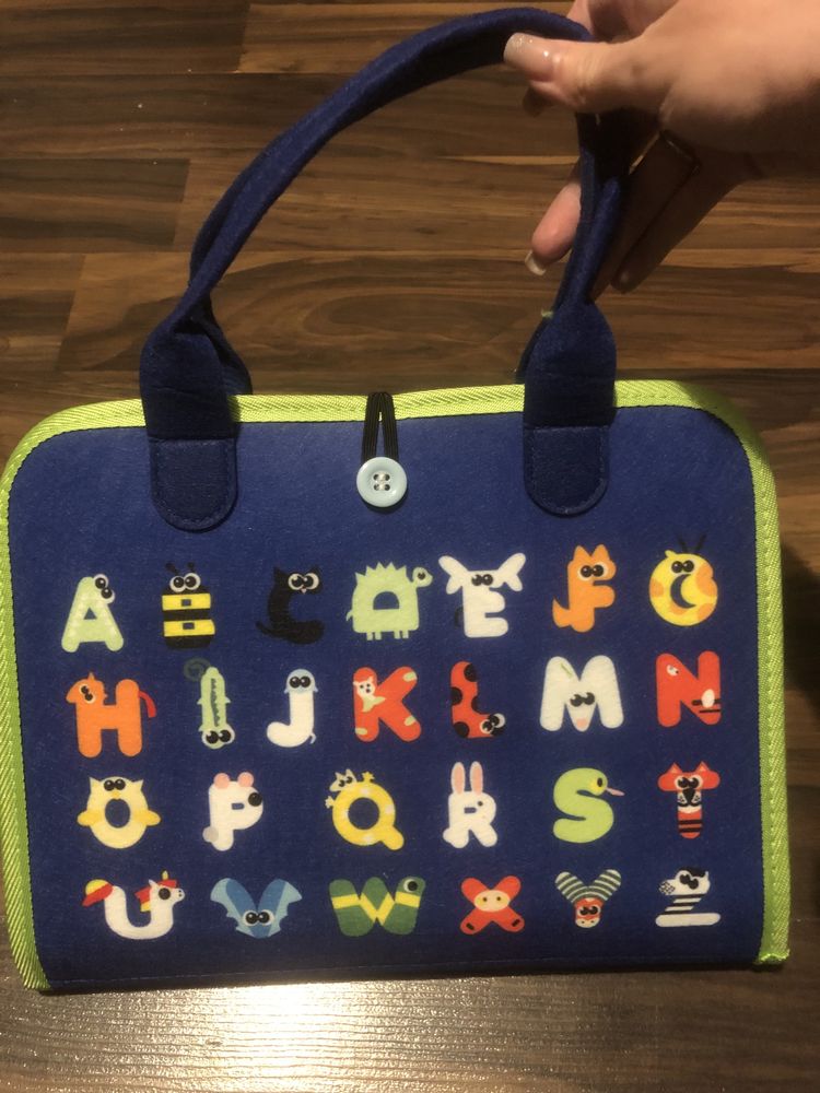 Książka tablica manipulacyjna edukacyjna rozwój motoryki montessori