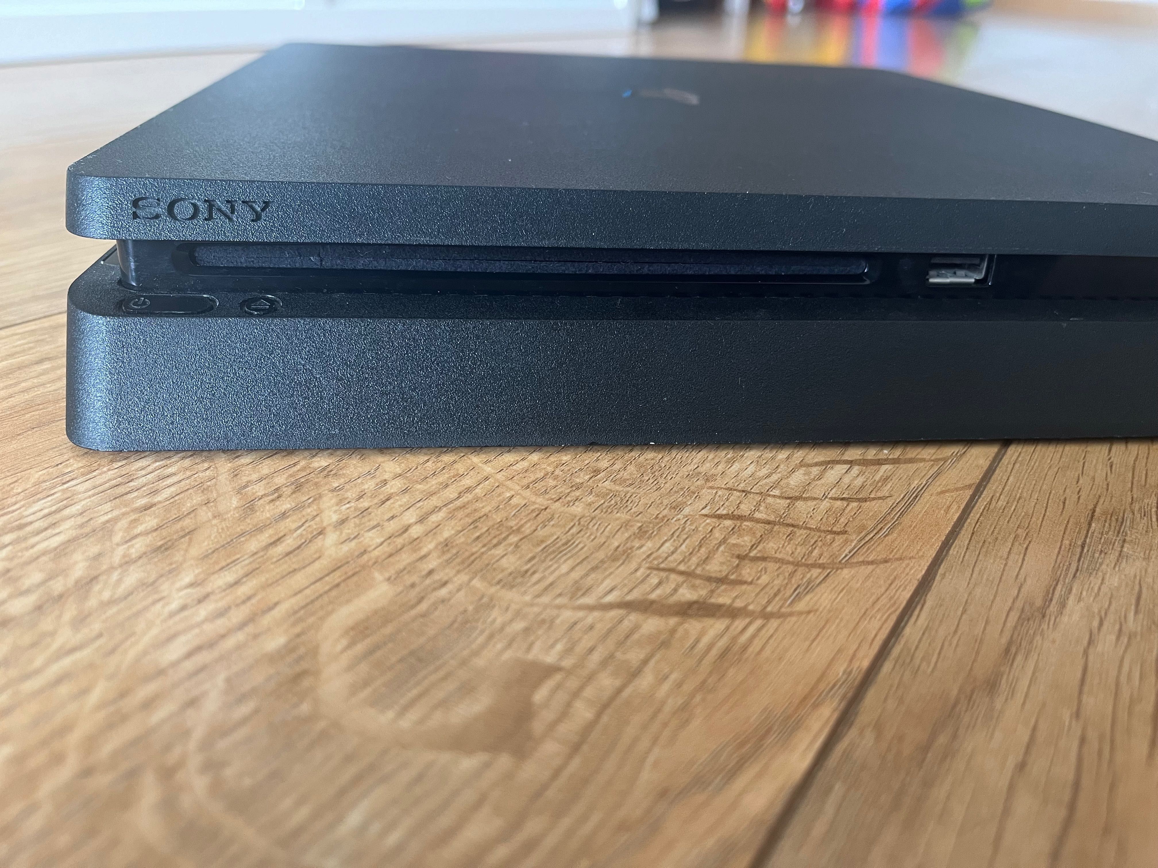 PlayStation 4 Slim 1 TB com comando wireless e 2 jogos