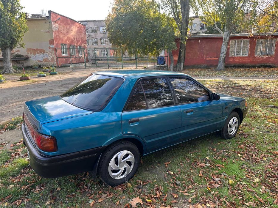 Mazda 323 расход 7л/100км