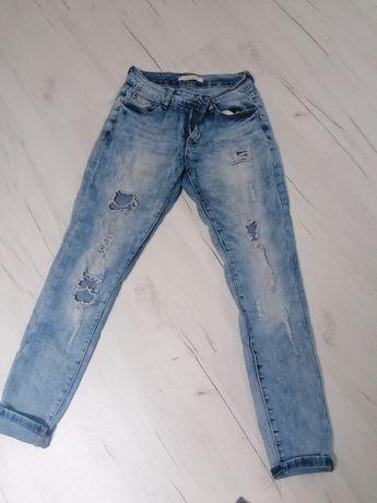 Spodnie jeansowe z rozdarciami r S